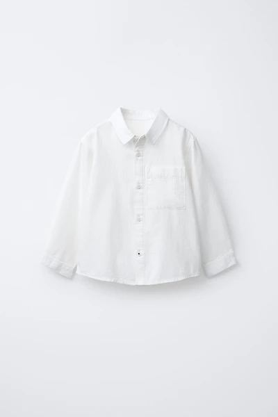 CHEMISE UNIE À POCHE