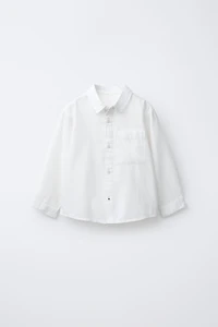 CHEMISE UNIE À POCHE