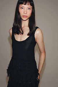 TOP EN MAILLE À FRANGES