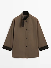 Waxed high neck parka with corduroy detail