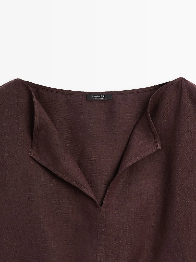 Linen blouse with elasticated hem