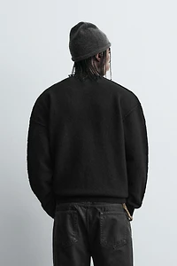 TEXTURED SWEATER WITH REVERSE EFFECT SEAMS