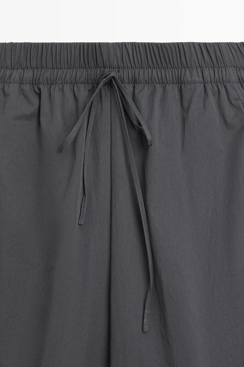 Cropped technical barrel fit pants