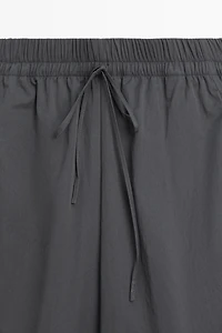 Cropped technical barrel fit pants