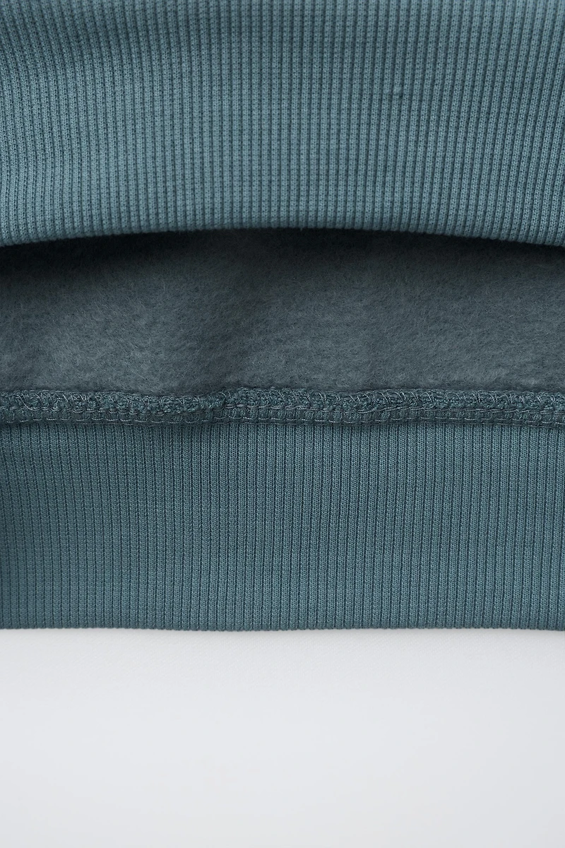 SWEAT UNI À CAPUCHE