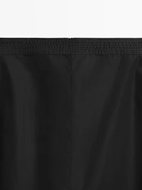 Jupe midi taille marquée