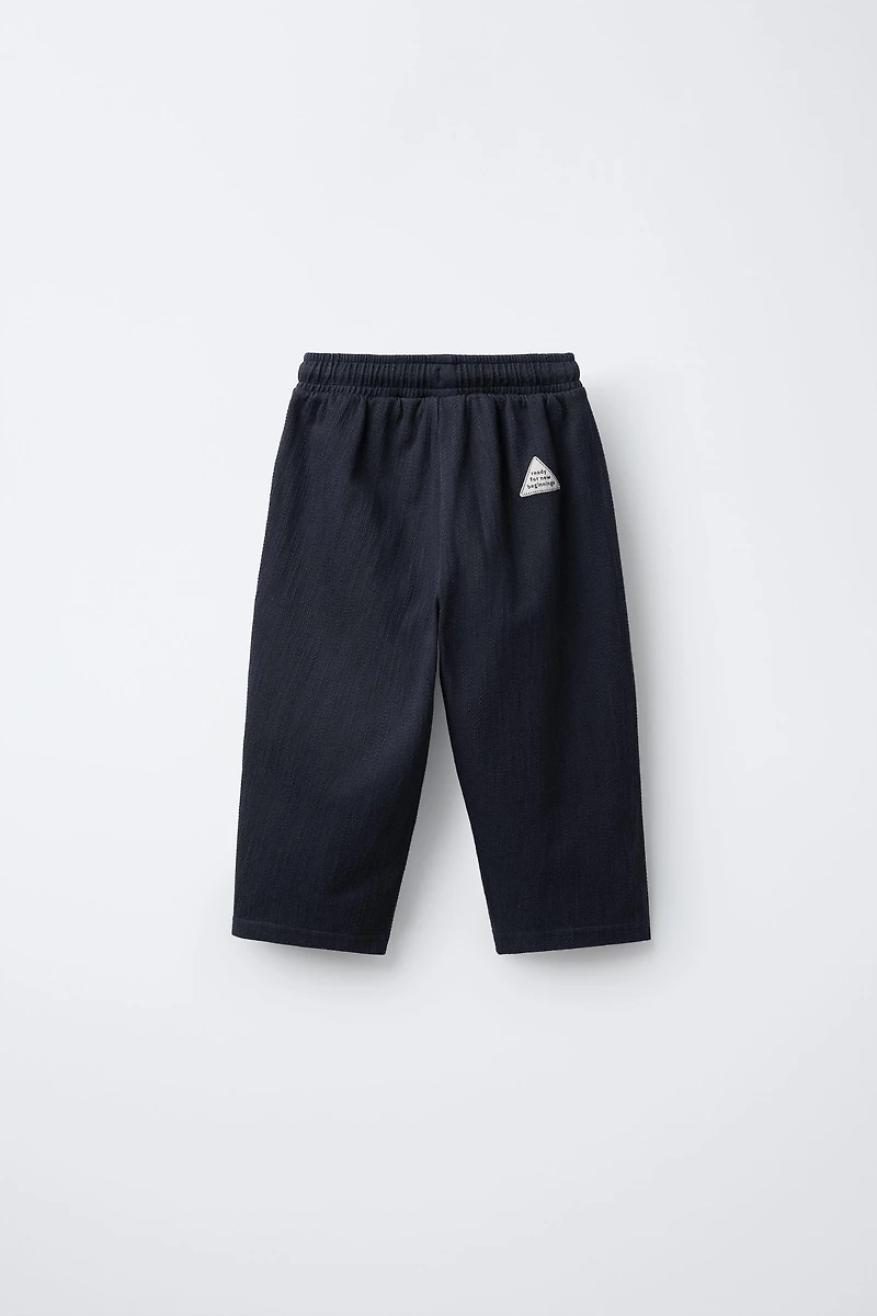PANTALON STRUCTURÉ AVEC ÉTIQUETTE