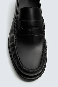 MOCASSINS EN CUIR AVEC MASQUE