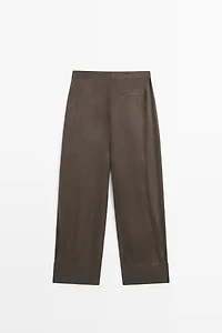 Total look flowing trousers with buttoned hems