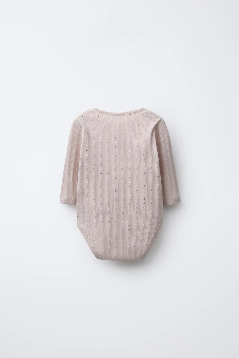 LOT DE CINQ BODYS IMPRIMÉ FLEURS