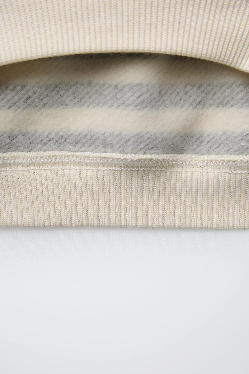 STRIPED SWEATSHIRT WITH FACE PATCH