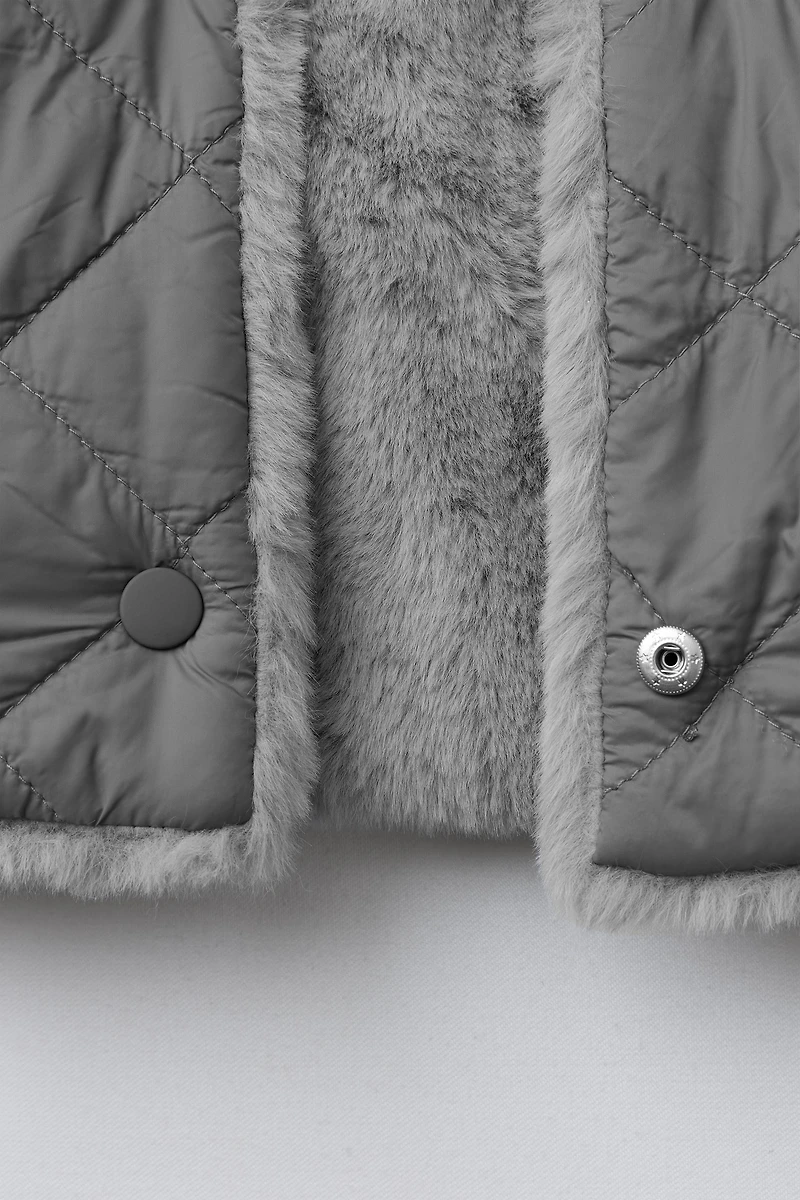 GILET RÉVERSIBLE EFFET FOURRURE