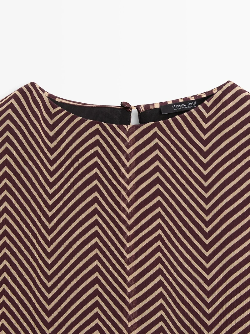 Flowing geometric print blouse