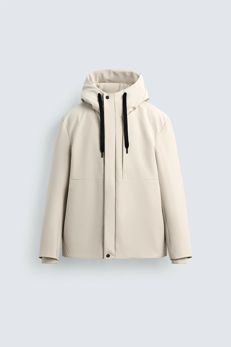 VESTE TECHNIQUE À CAPUCHE