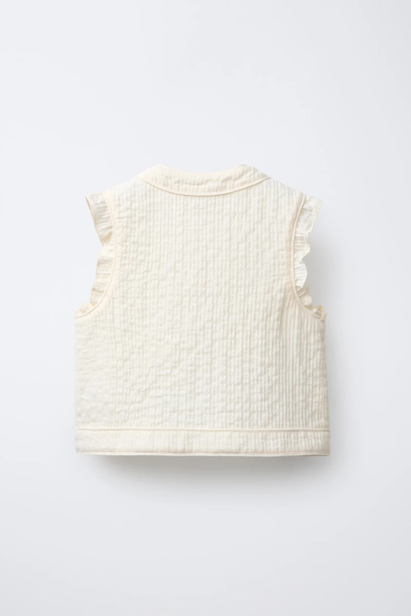 GILET STRUCTURÉ À VOLANTS