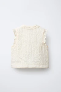 GILET STRUCTURÉ À VOLANTS
