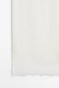 Flowing midi skirt with lace detail