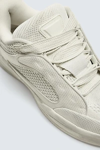 DISTRESSED THICK-SOLED SNEAKERS