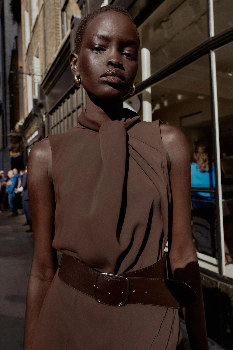 SLEEVELESS BELTED JUMPSUIT