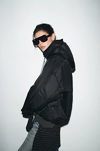 VESTE MATELASSÉE À CAPUCHE DÉPERLANTE ET COUPE-VENT