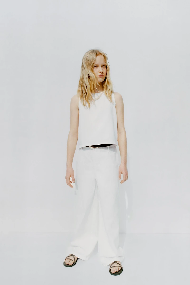 SLEEVELESS ZIP TOP