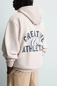 SWEAT À CAPUCHE IMPRIMÉ