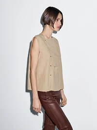 Blouse with silver button fastening on the side