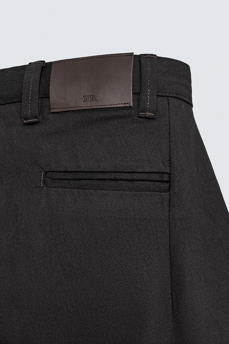 PLEATED BALLOON FIT JEANS