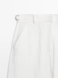 Flowing trousers with buckles