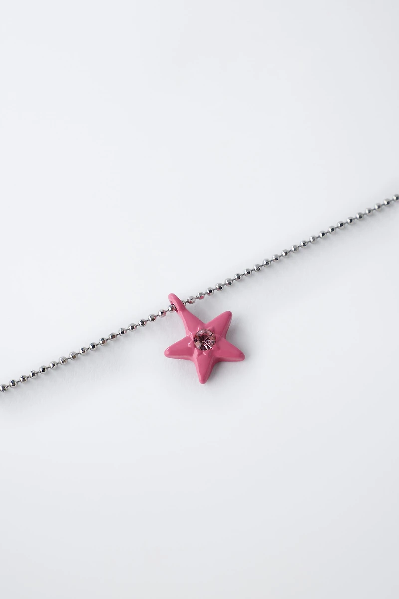 PACK OF TWO DICE AND STAR NECKLACES