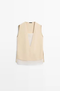 Flowing double-layer top with contrast detail