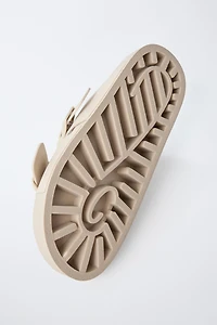 BUCKLED POOL SLIDES