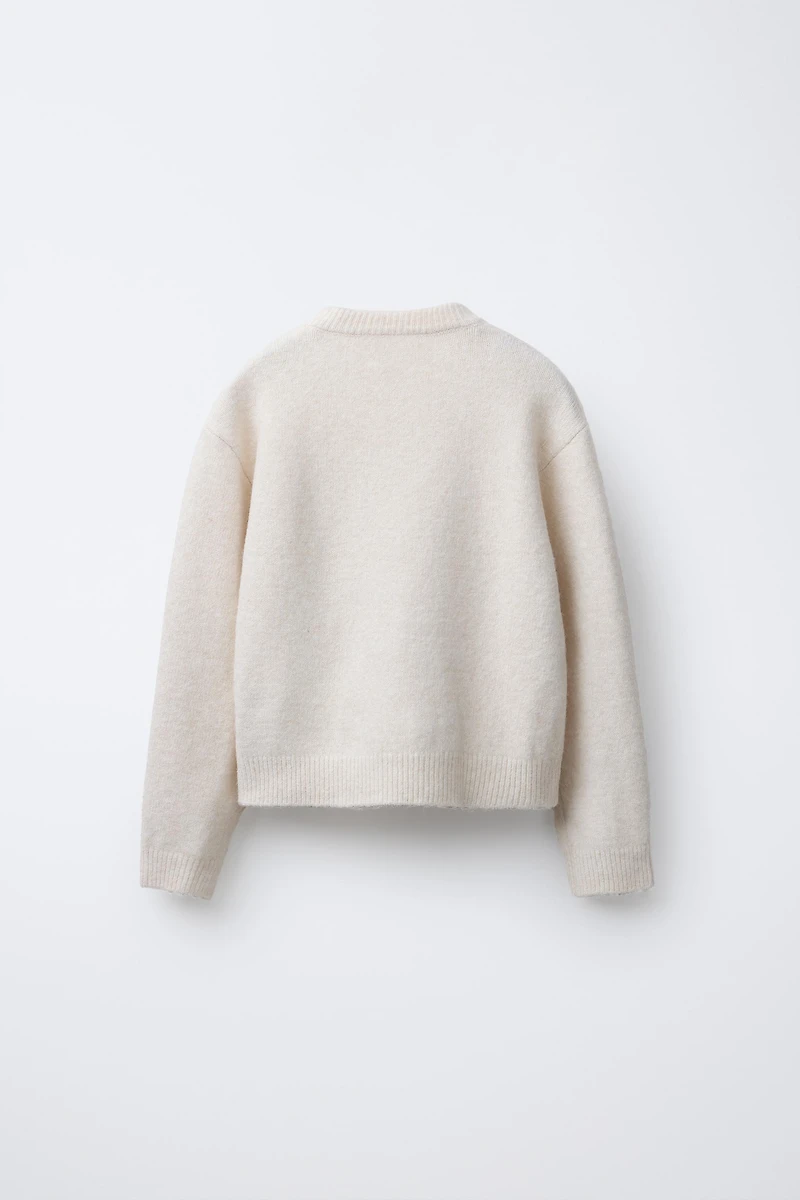 PULL EN MAILLE FLEURS PAILLETTES