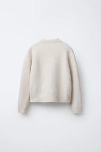 PULL EN MAILLE FLEURS PAILLETTES