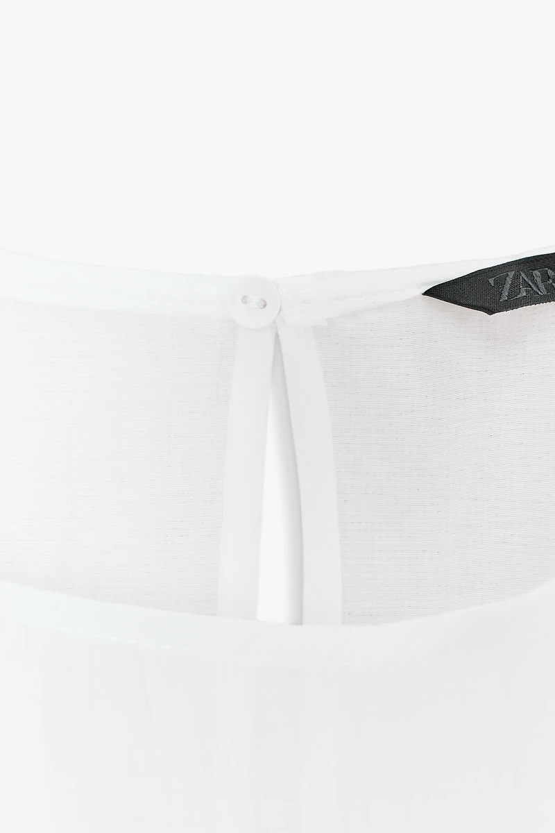 SEMI-SHEER RUFFLED BLOUSE