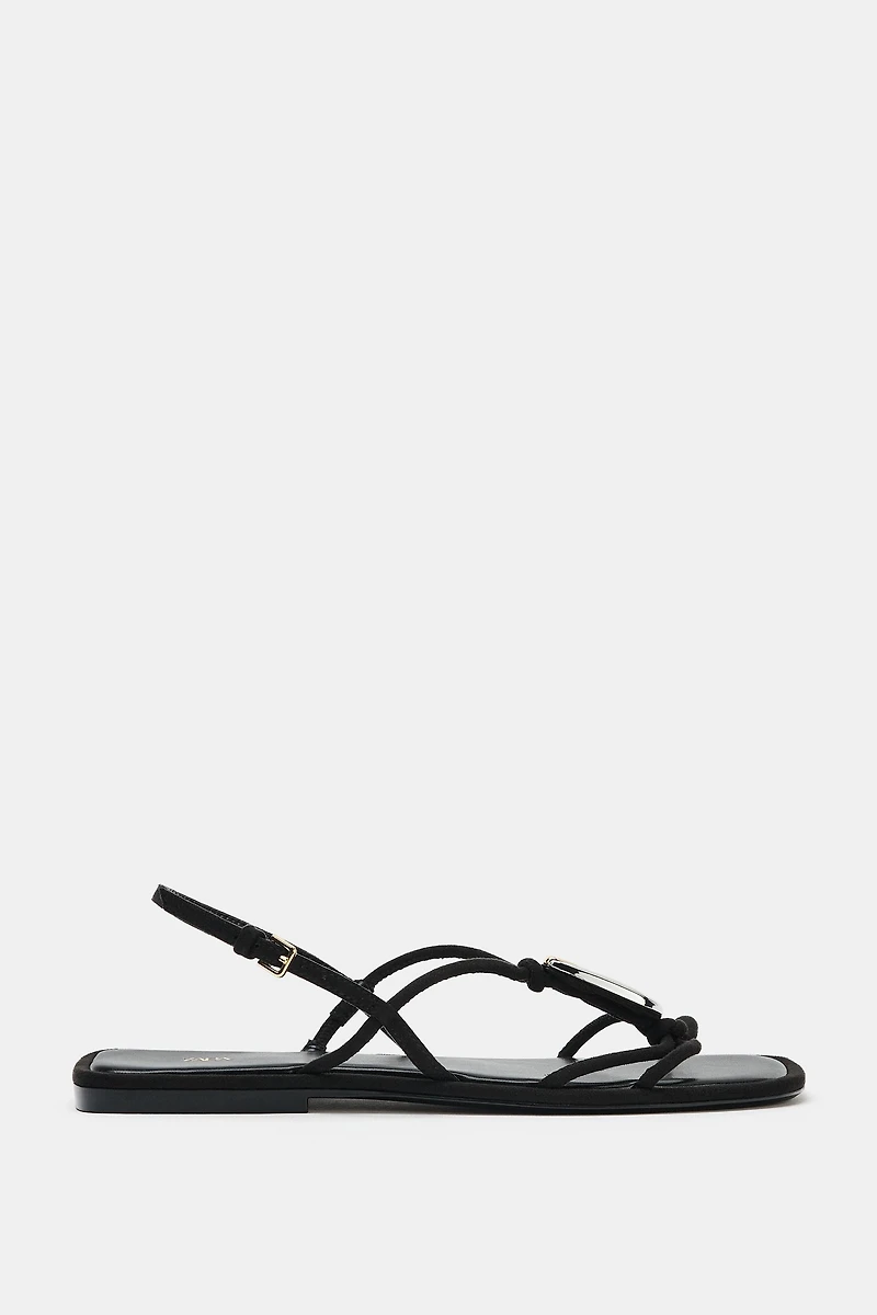 FLAT SANDALS WITH METALLIC APPLIQUÉ
