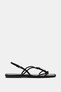 FLAT SANDALS WITH METALLIC APPLIQUÉ