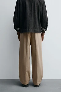 RELAXED FIT PLEATED PANTS