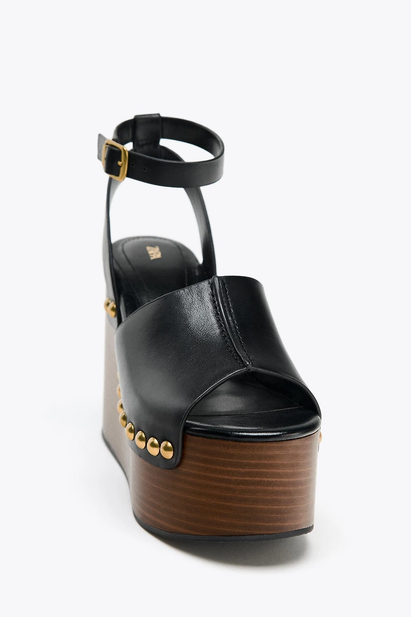 STUDDED LEATHER WEDGE SANDALS