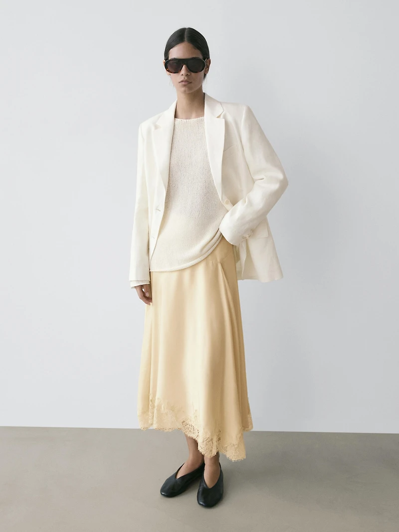 Asymmetric skirt with lace-trimmed detail