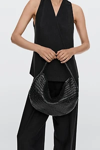 Braided leather half-moon bag