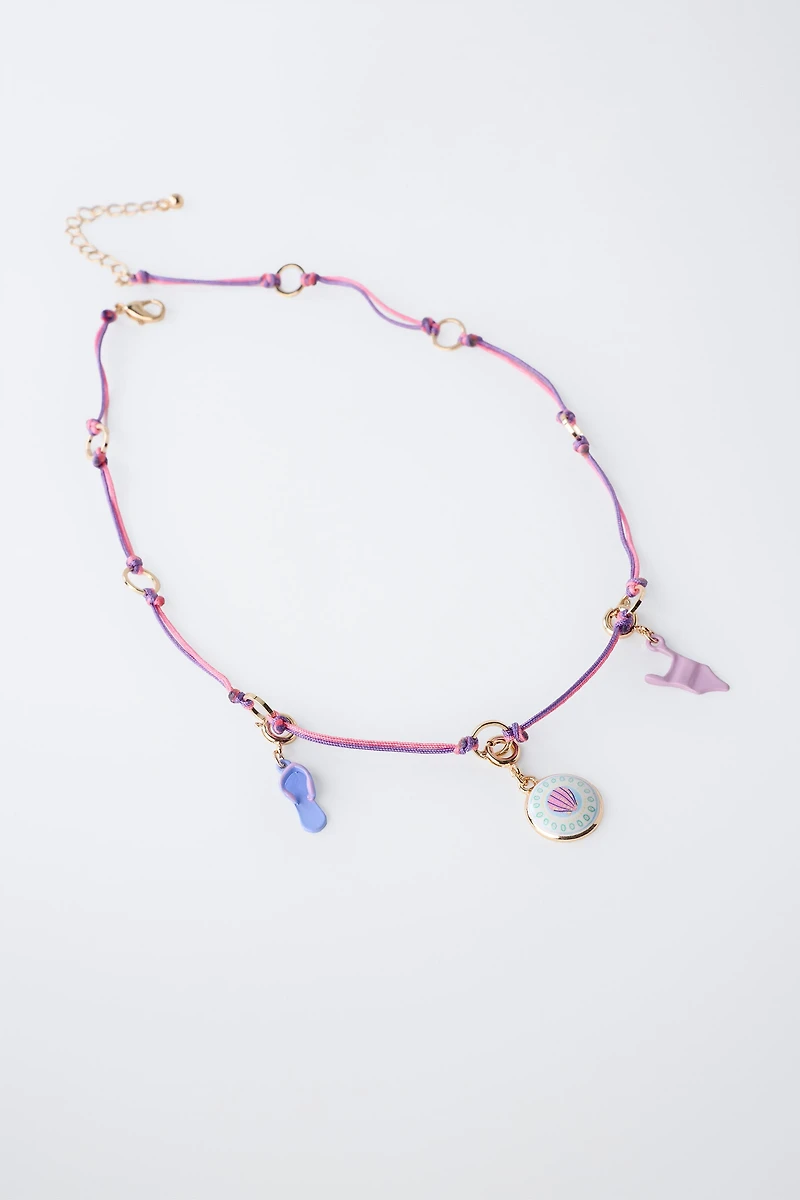 INTERCHANGEABLE MULTI-CHARM NECKLACE