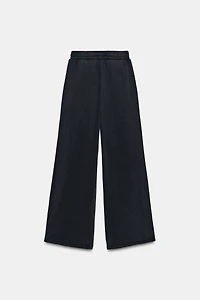 WASHED EFFECT FLEECE PANTS WITH STUDS