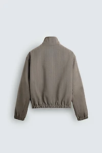 BLOUSON COURT COUPE STRUCTURÉE À CHEVRONS