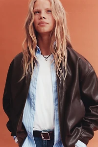 BLOUSON EN MATIÈRE SYNTHÉTIQUE