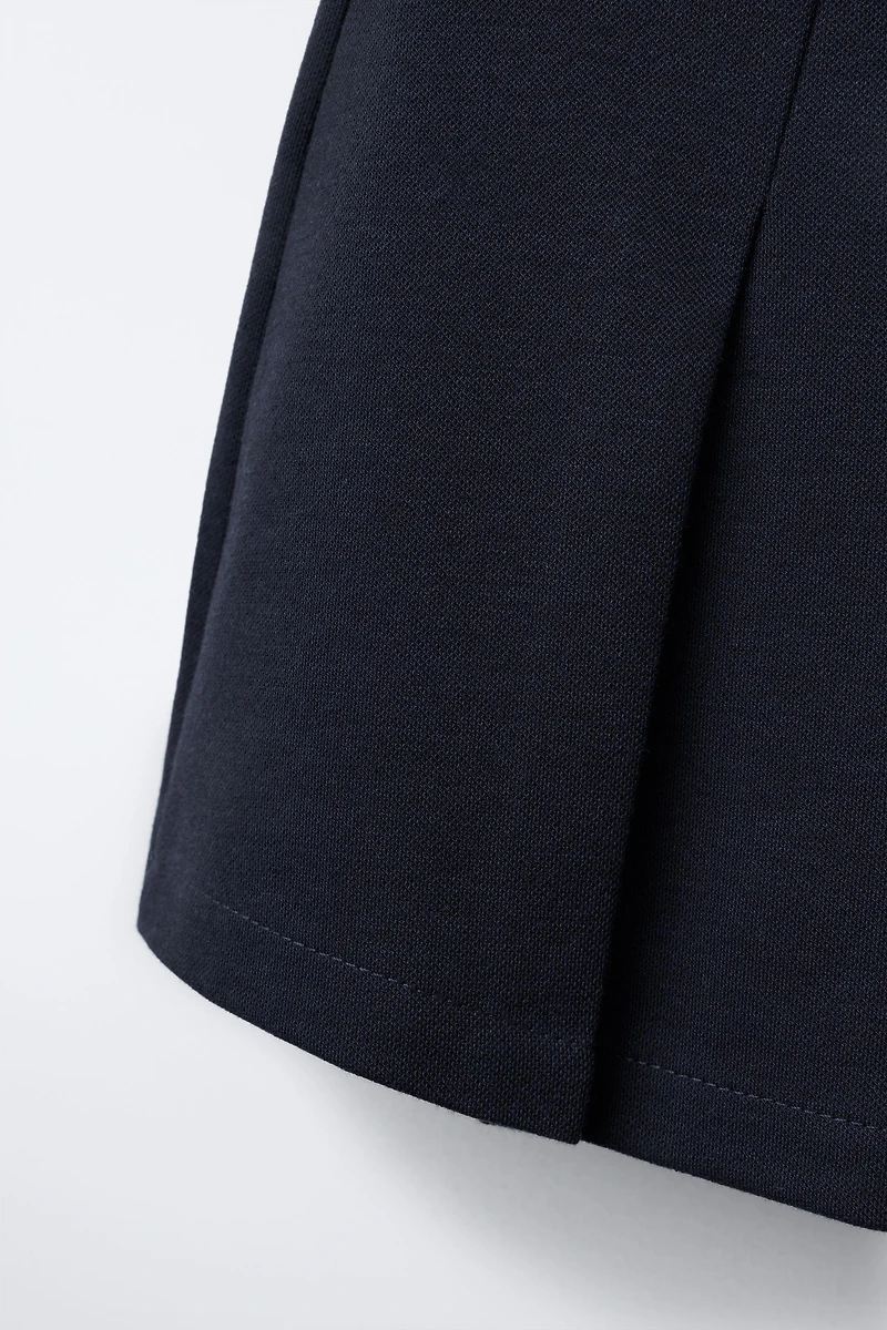 BUCKLE SKORT