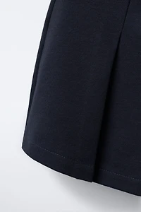 BUCKLE SKORT