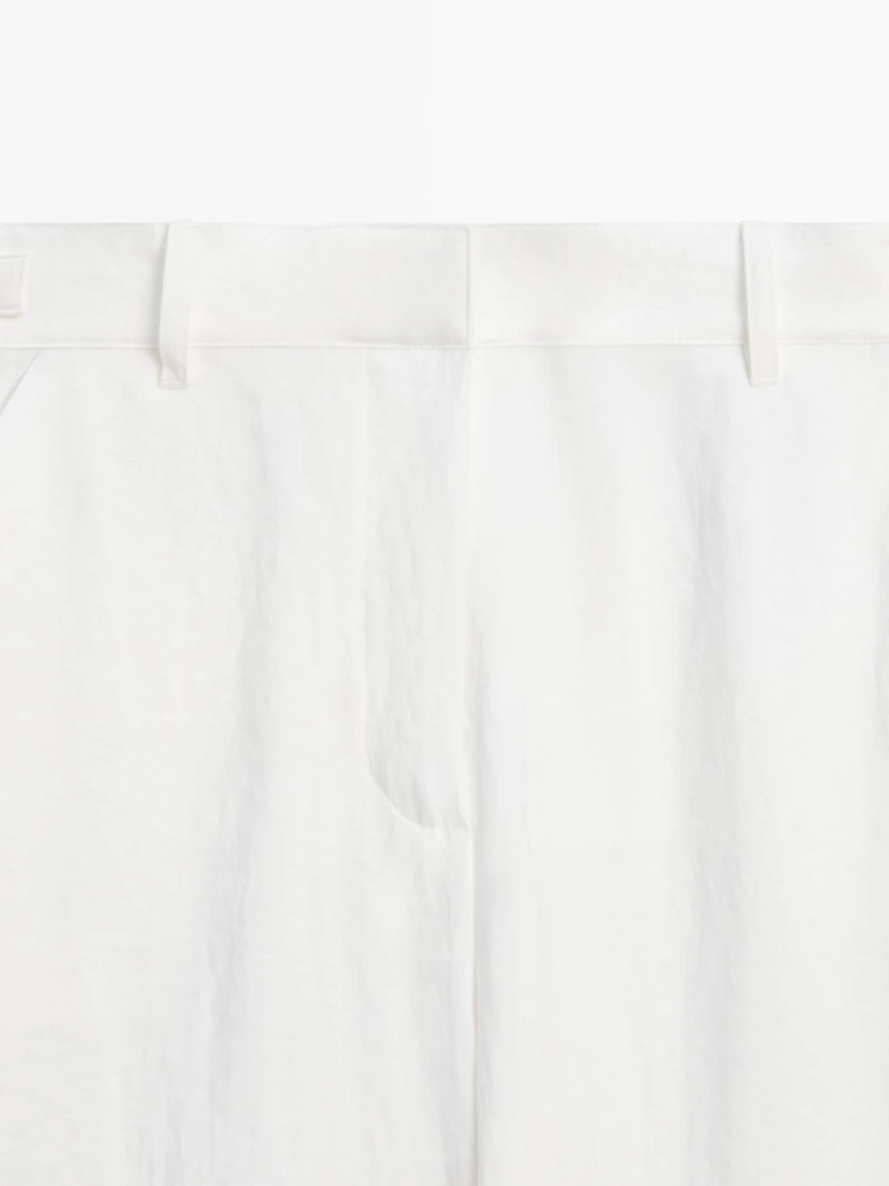 Flowing trousers with buckles