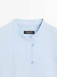 Shirt with stand collar and bib