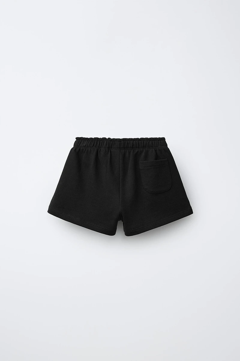 RUBBERIZED APPLIQUÉ PLUSH SHORTS
